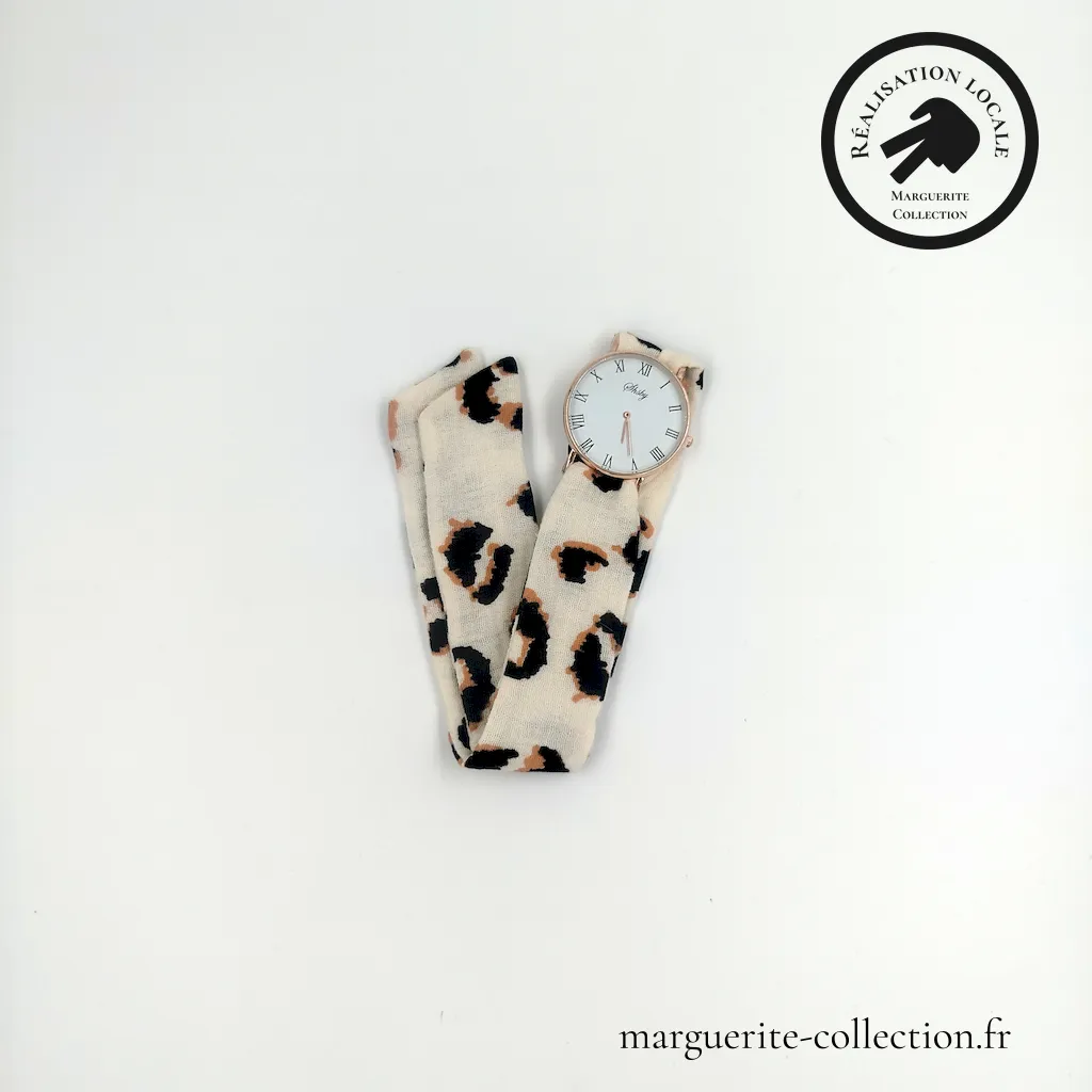 Marguerite-Collection_Montre_Dorée_Maxi_L'Audacieuse_Double Gaze Léopard_WEBP Marguerite Collection Montre Doree Maxi LAudacieuse Double Gaze Leopard WEBP - Montre à nouer "L'audacieuse" pour femmes. Avec un bracelet en tissu coton de qualité. Plusieurs choix possibles de bracelets. Plusieurs types de cadrans proposés: Maxi dorée, Maxi argentée et Mini dorée. - 20,00 €