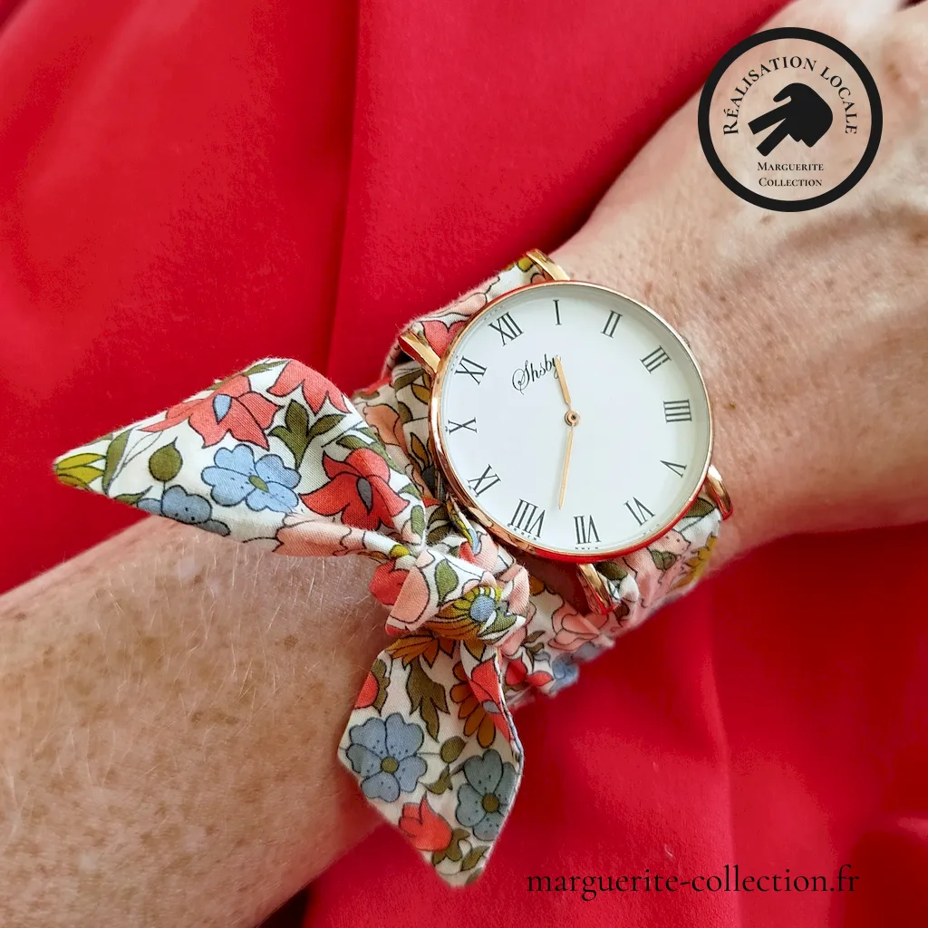 Marguerite-Collection_Montreànouer_Maxi dorée_Lliberty_Poppyanddaisy_WEBP Marguerite Collection Montreanouer Maxi doree Lliberty Poppyanddaisy WEBP - Montre avec bracelet en tissu Liberty de qualité, à nouer autour du poignet. Plusieurs choix possibles de bracelets. Plusieurs types de cadrans proposés: Maxi dorée, Maxi argentée et Mini dorée. - 28,00 €